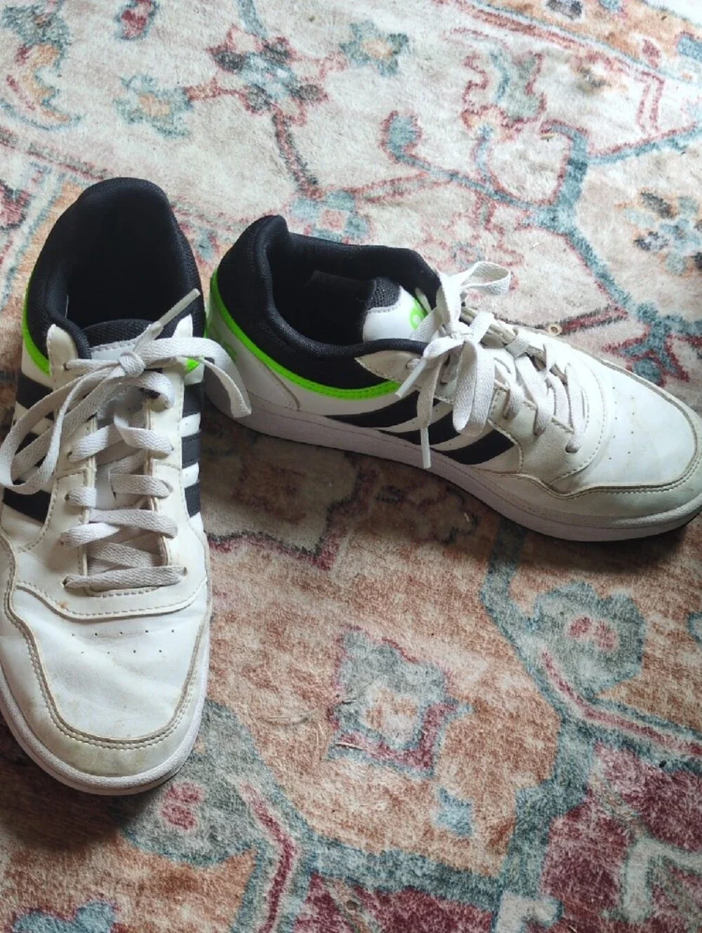 White Adidas Sneakers with Black Stripes and Neon Green Accent